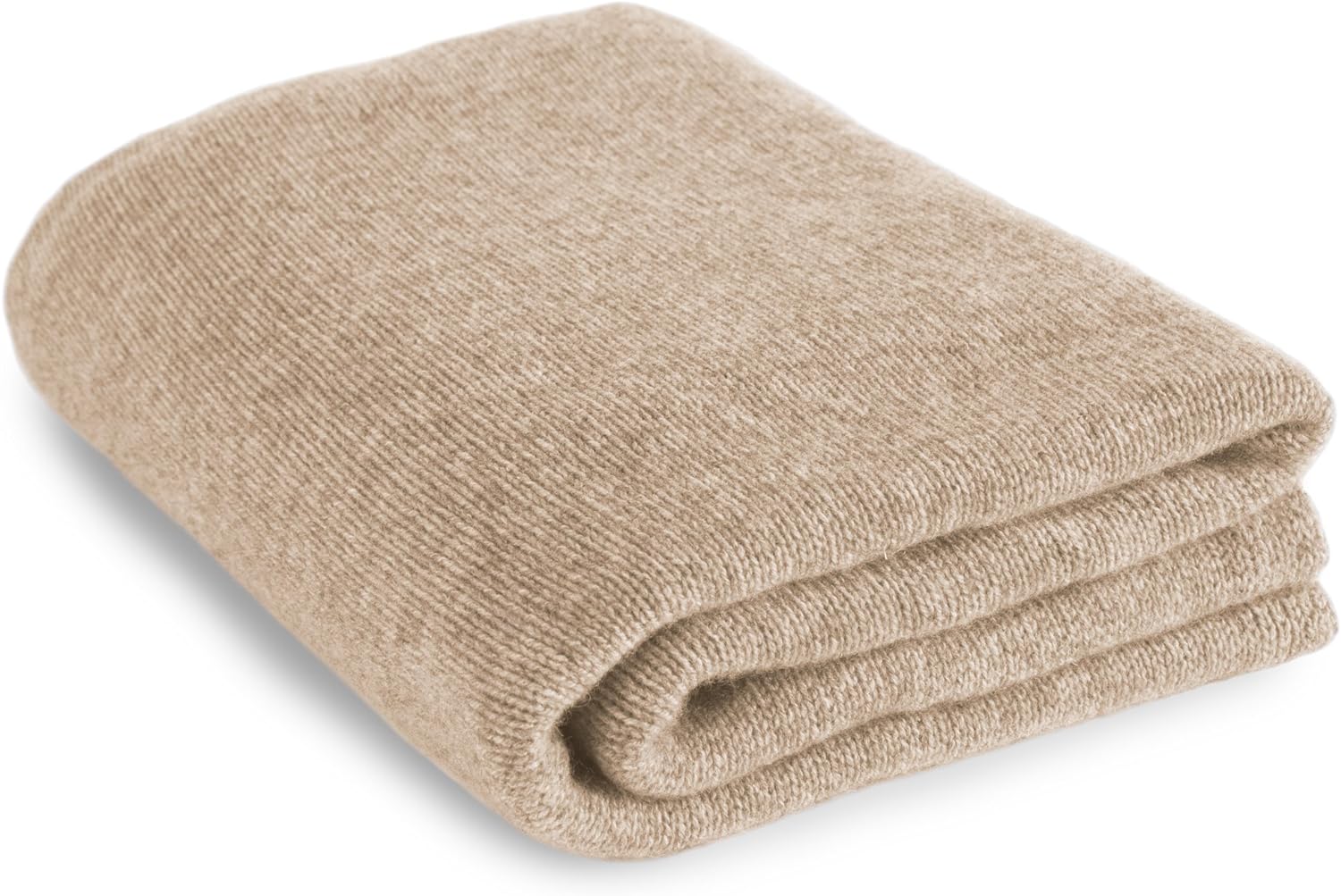 A beige blanket folded on top of a white background.