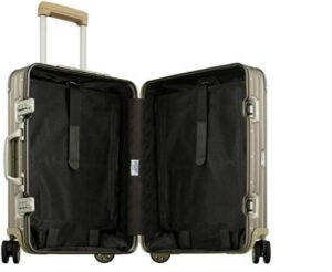 A suitcase with wheels and handles on a white background.