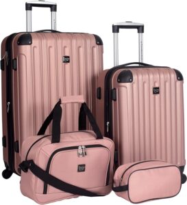 Four pieces of pink luggage with handles and wheels.