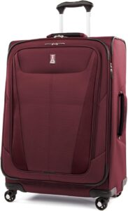 A burgundy suitcase with wheels on a white background.