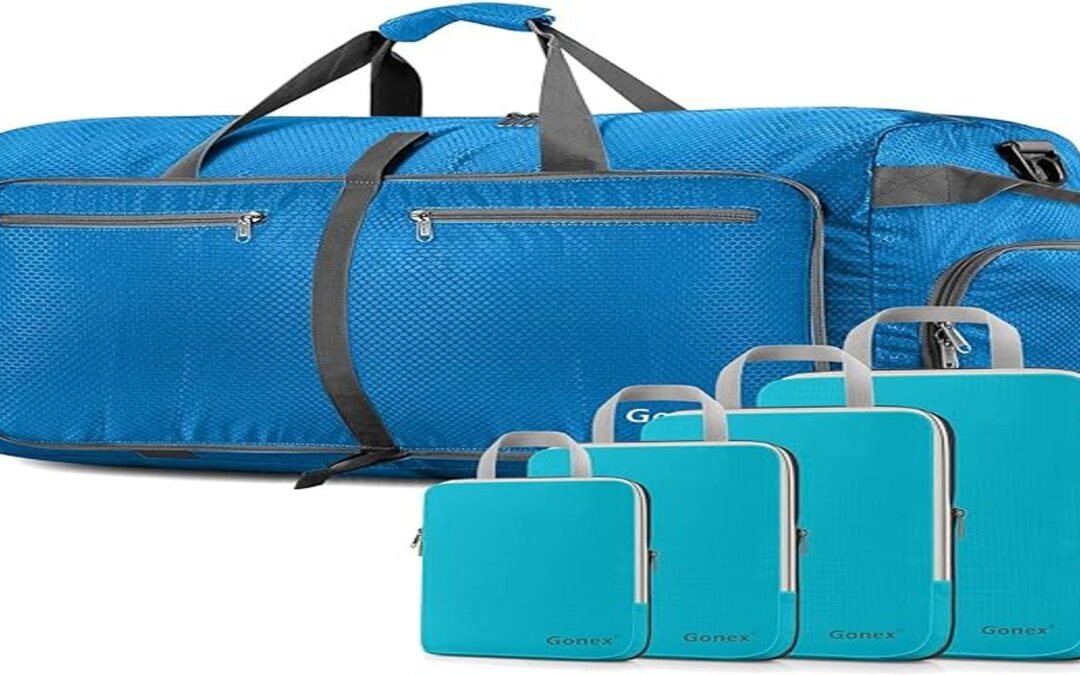 A set of blue Gonex travel bags of various sizes, including a Gonex 150L Travel Duffel Bag with Compression Packing Cubes, displayed together.